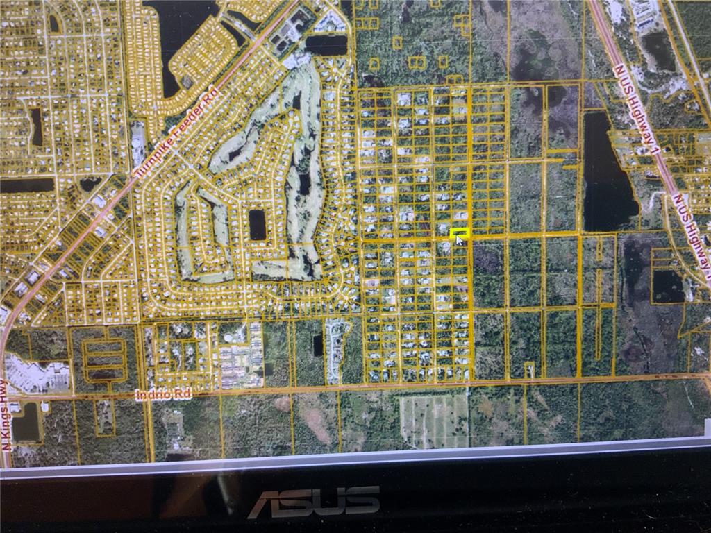 This is a satellite map view showing a highlighted property lot within a residential neighborhood — SNAIL KITE LANE, FORT PIERCE, FL