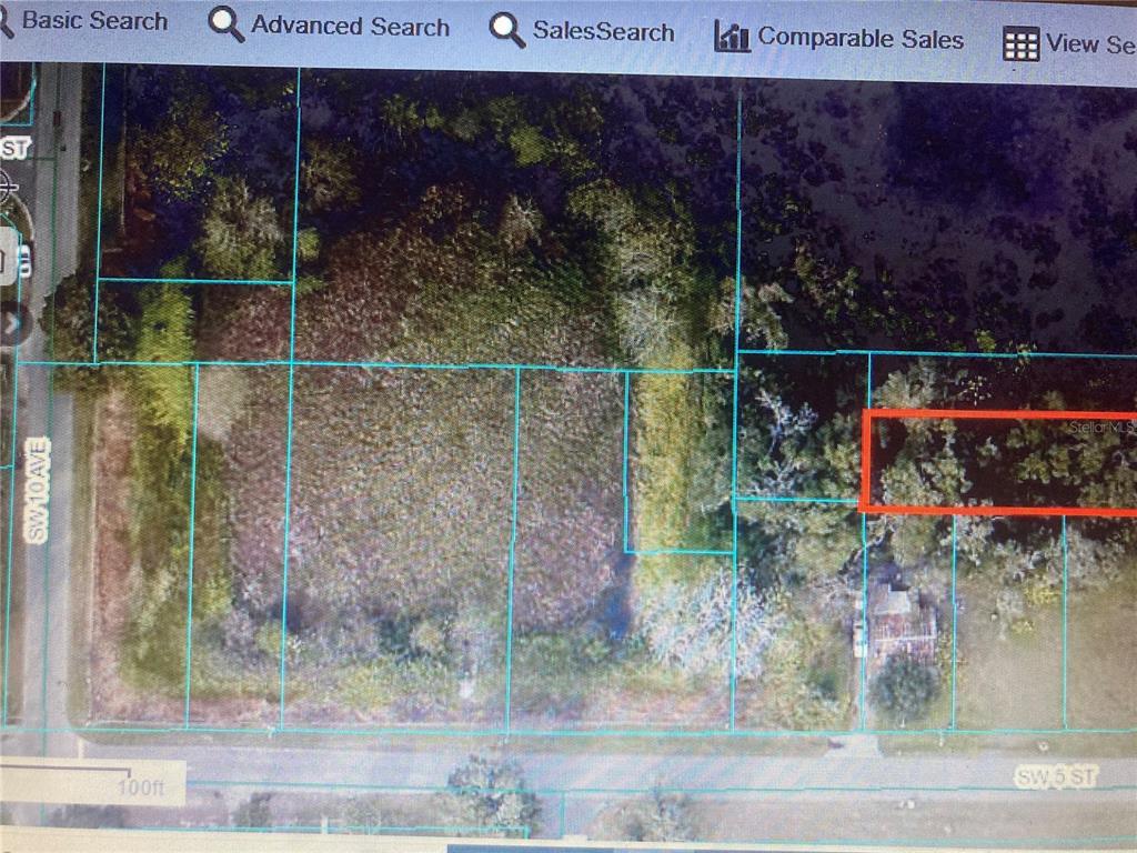 This is a satellite map view showing a rectangular plot of land outlined in red — SW 5TH ST, OCALA, FL