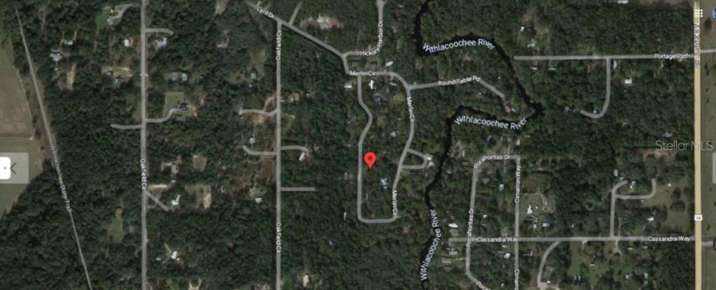 This is a satellite map view showing a residential area near the Withlacoochee River — 4842 MERLIN CIR CIRCLE, DADE CITY, FL