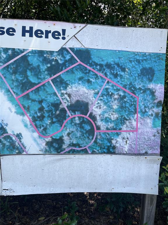 This is a sign displaying a map of a residential lot layout — 845 LARK COURT, DELTONA, FL