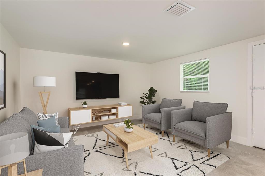 A living room features gray furniture, a wooden coffee table, and a television on a console — 8120 MARCHANT DRIVE, NEW PORT RICHEY, FL