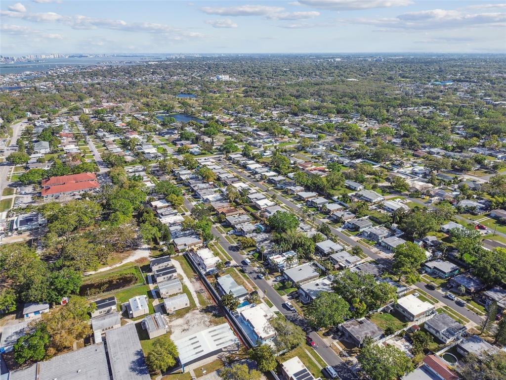 An aerial view shows a dense residential neighborhood with many single-story homes and trees — 12252 ELDON DRIVE, LARGO, FL