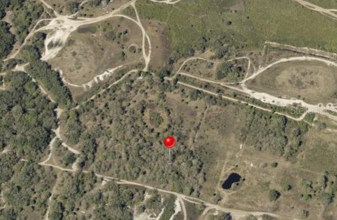 This is an aerial map view of a large, undeveloped, wooded plot of land — 300TH STREET, OKEECHOBEE, FL