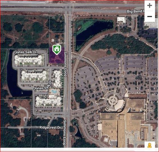 This is an aerial map showing a property lot highlighted in purple along Simmons Loop — 6906 SIMMONS LOOP, RIVERVIEW, FL