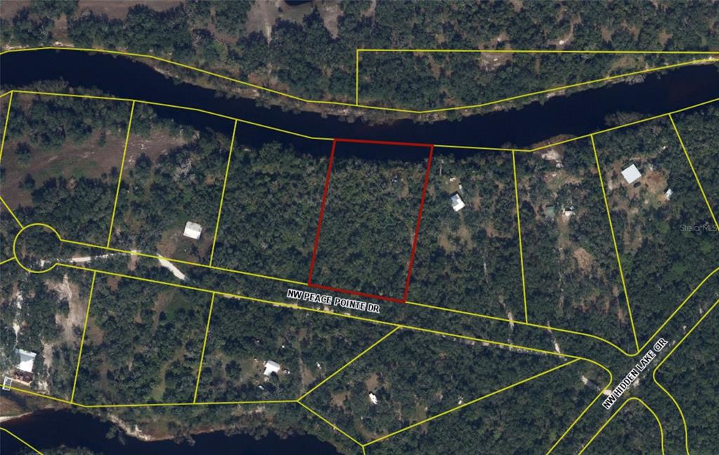 This is an aerial map showing a rectangular parcel of land highlighted in red — 1234 NW PEACE POINTE DRIVE, ARCADIA, FL