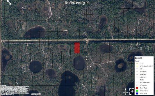 This aerial map shows a rectangular red parcel of land surrounded by forest and ponds — N/A, INDIANTOWN, FL