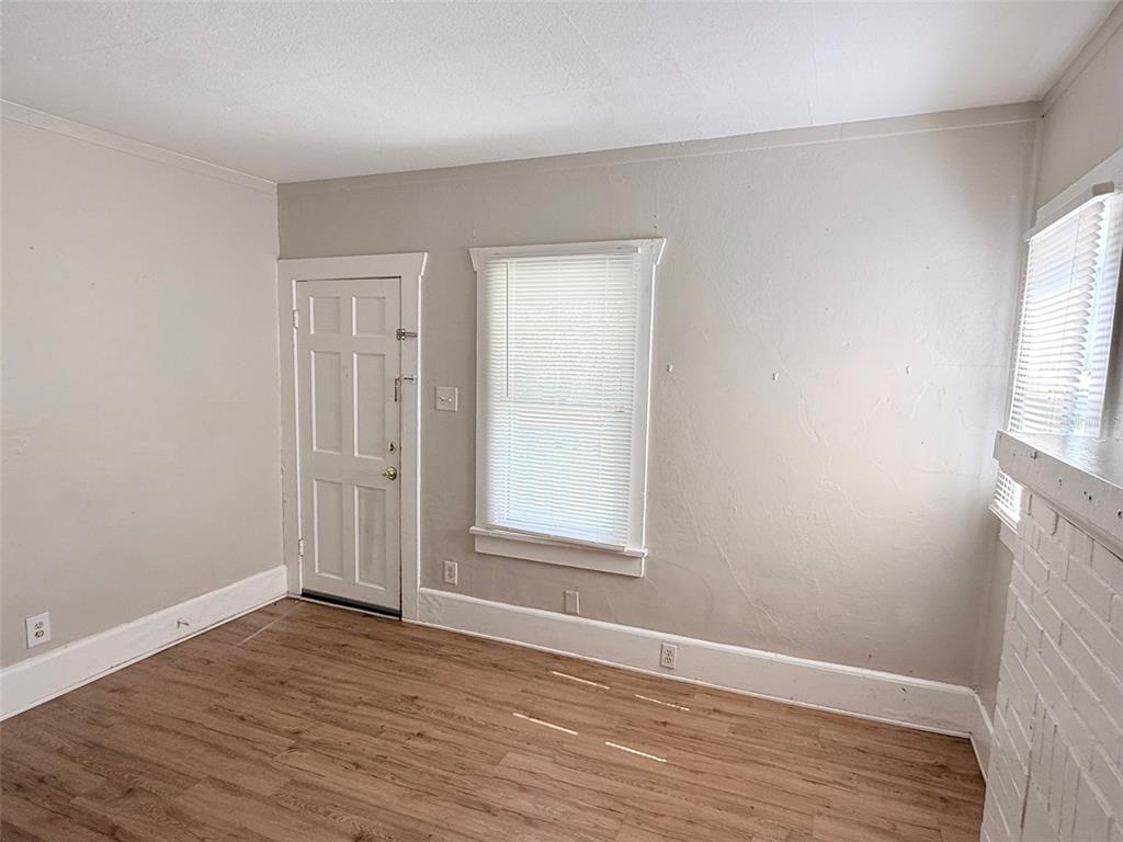 A kitchen features light gray cabinets, a butcher block countertop, a double sink, and tile flooring — 776 27TH AVENUE N UNIT 2, ST PETERSBURG, FL