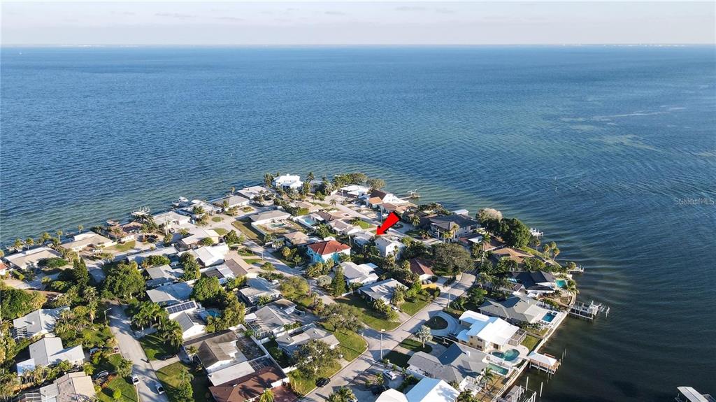 A single-story house with a white and gray exterior, a two-car garage, and a driveway — 2671 W BAY ISLE DRIVE SE, ST PETERSBURG, FL