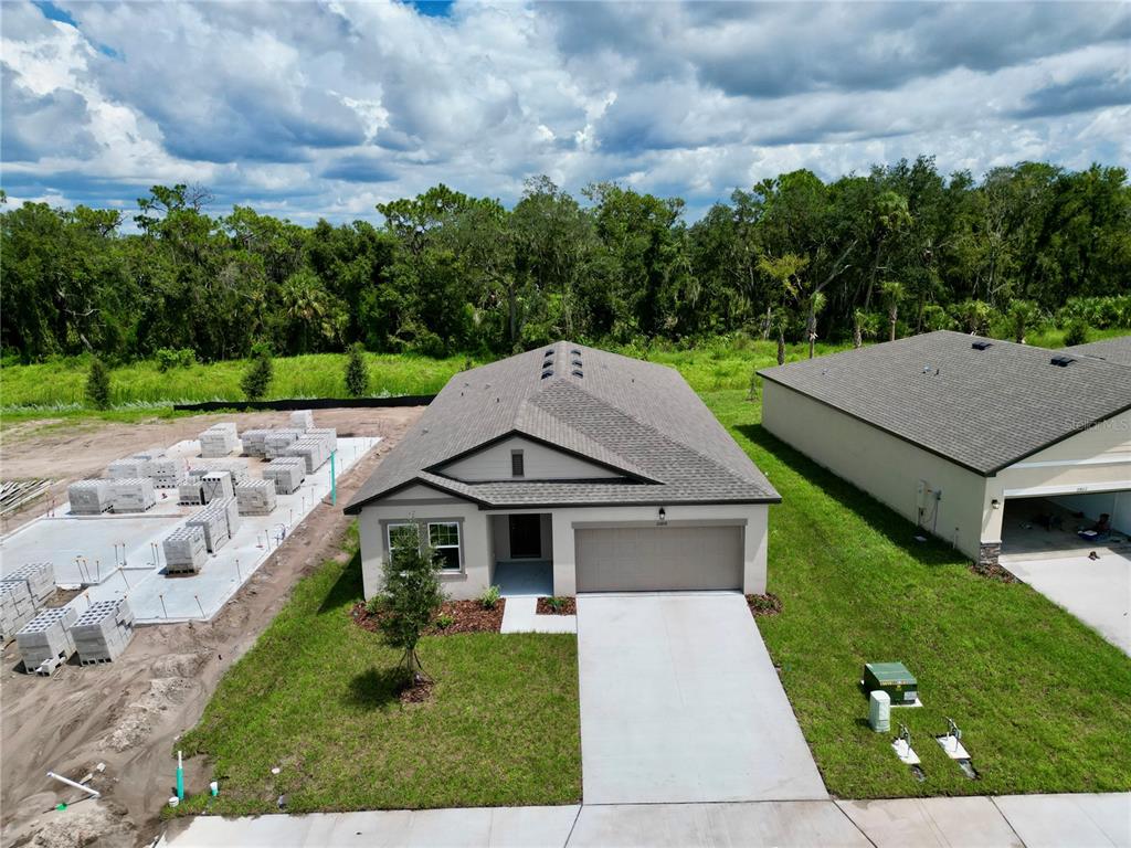 This is a floor plan for a five-bedroom home with a two-car garage and patio — 10858 CURVING CREEK LOOP, PARRISH, FL