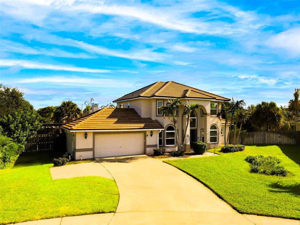 An aerial view shows a house with a brown tile roof, pool, and spa — 3059 N RIO PLUMOSA N, INDIALANTIC, FL