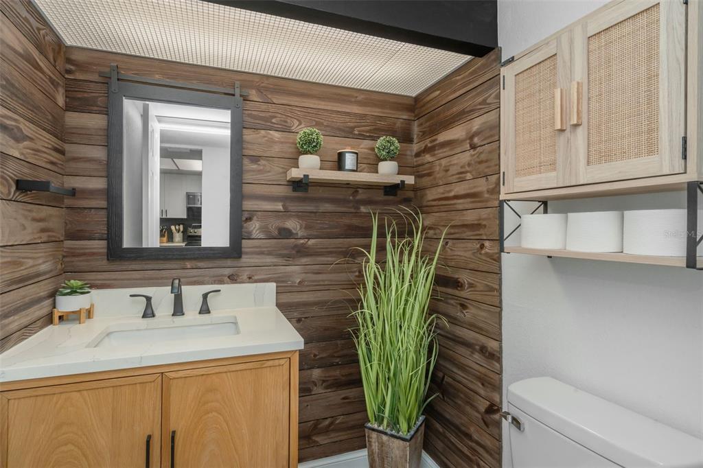 A dining area with a wooden table, six chairs, and a view into the kitchen — 2614 COVE CAY DRIVE UNIT 102, CLEARWATER, FL
