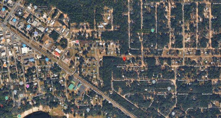 This is an aerial map view showing a wooded residential area with a red location pin — 6436 BAYLOR AVENUE, KEYSTONE HEIGHTS, FL