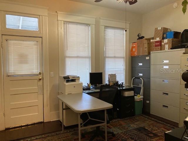 An office room features a white door, two windows with blinds, a desk, and filing cabinets — 806 W DE LEON STREET, TAMPA, FL