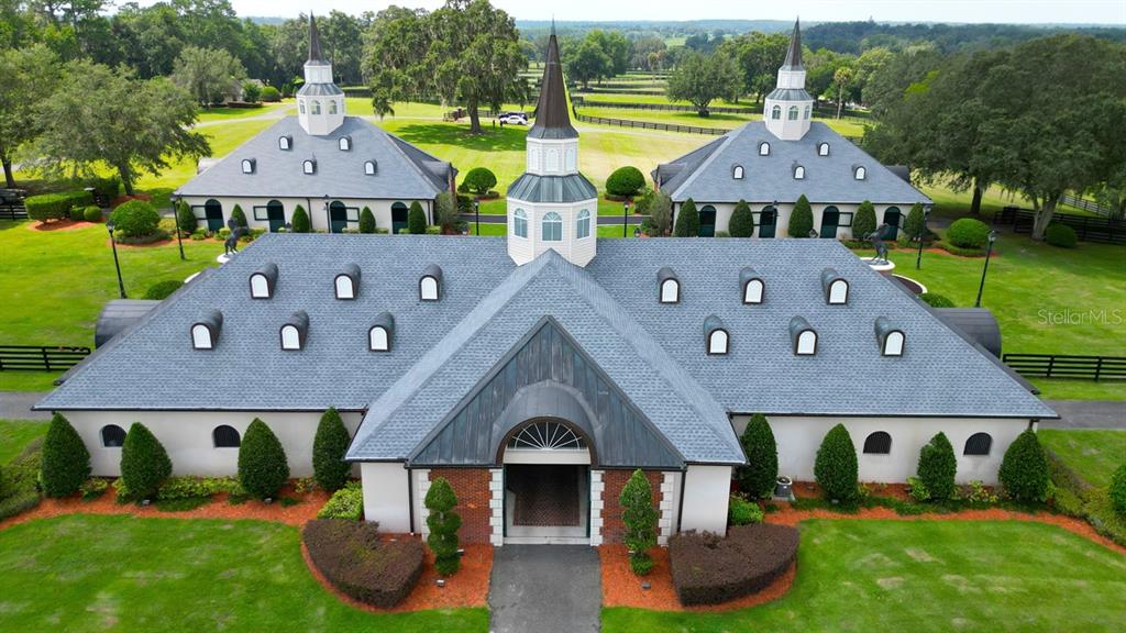 An aerial view shows a large, symmetrical building with multiple cupolas and dormer windows — 6500A NW 193RD STREET UNIT Option 1, MICANOPY, FL