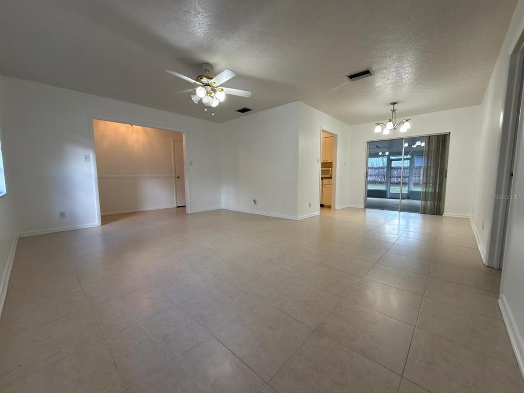 A single-story house with a concrete driveway, two-car garage, and large oak trees — 2209 BOXWOOD WAY, BRANDON, FL