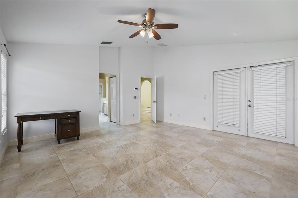 A spacious living area features vaulted ceilings, skylights, tile flooring, and a dining nook — 2243 BANCROFT BOULEVARD, ORLANDO, FL