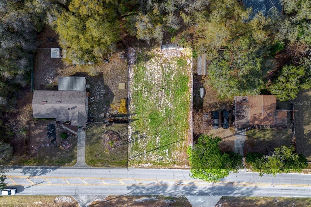 An aerial view shows a rural residential property with a house marked by a pin — LAKE GRIFFIN ROAD, LADY LAKE, FL