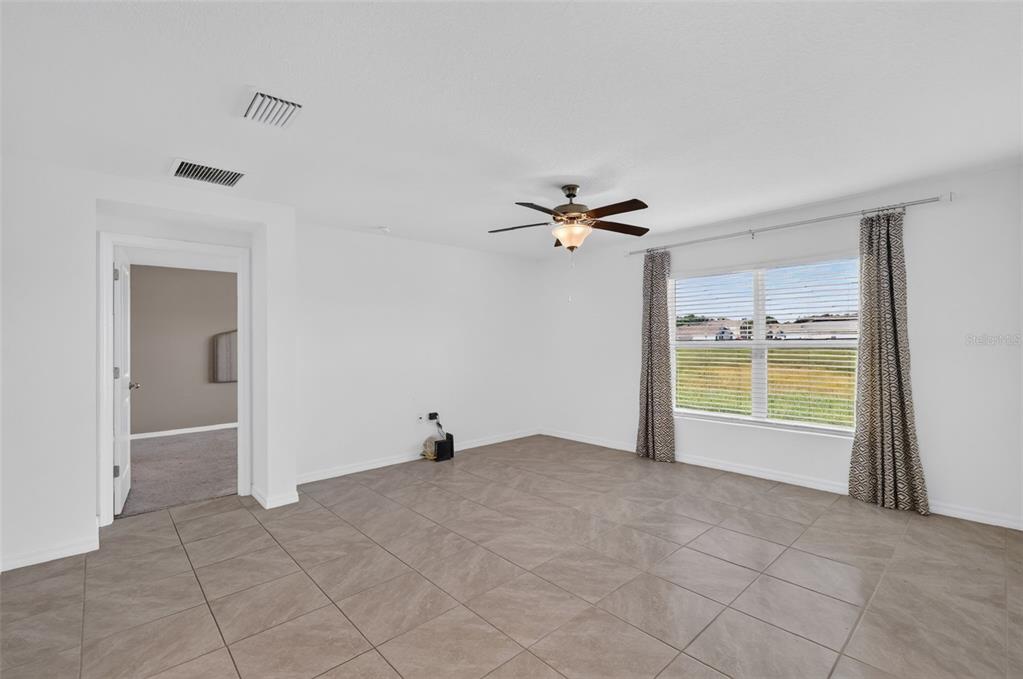 8510 TRIUMPH CIRCLE, WILDWOOD, FL — photo 4 of 30