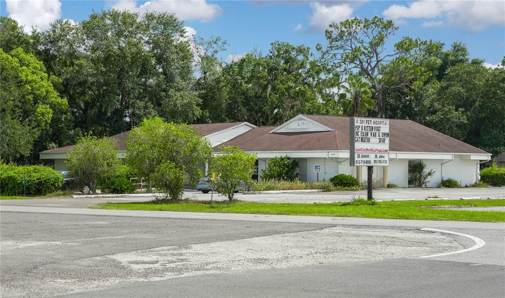 A single-story commercial building with a brown roof and a prominent sign for a pet hospital — 5821 GALL BOULEVARD, ZEPHYRHILLS, FL