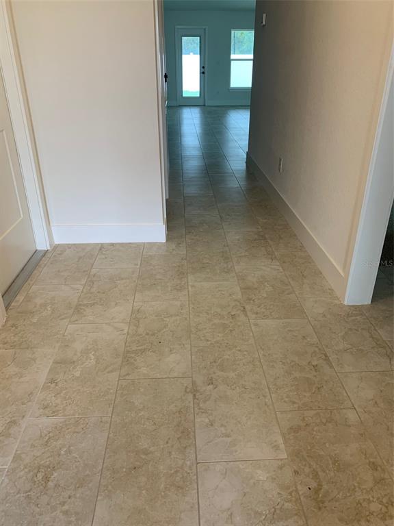 This is a floor plan for a 1,635-square-foot, four-bedroom, two-bath home with a garage — 11611 GRACE ROAD, WEEKI WACHEE, FL