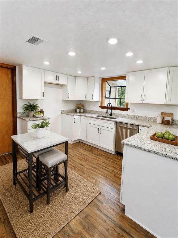 A kitchen sink with a dark faucet is positioned beneath a window with wood trim — 2598 ENTERPRISE OSTEEN ROAD, OSTEEN, FL