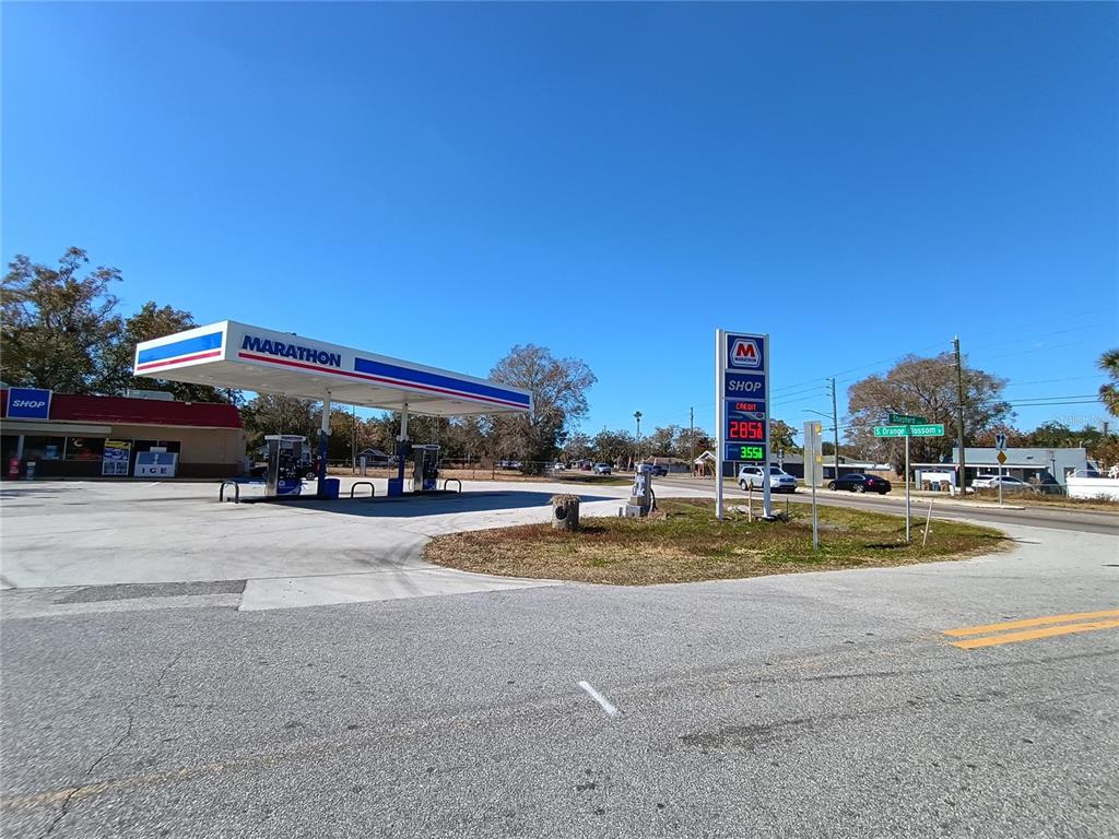 A Marathon gas station with a convenience store and fuel pumps under a canopy — 1608 SHEPHERD LANE, INTERCESSION CITY, FL