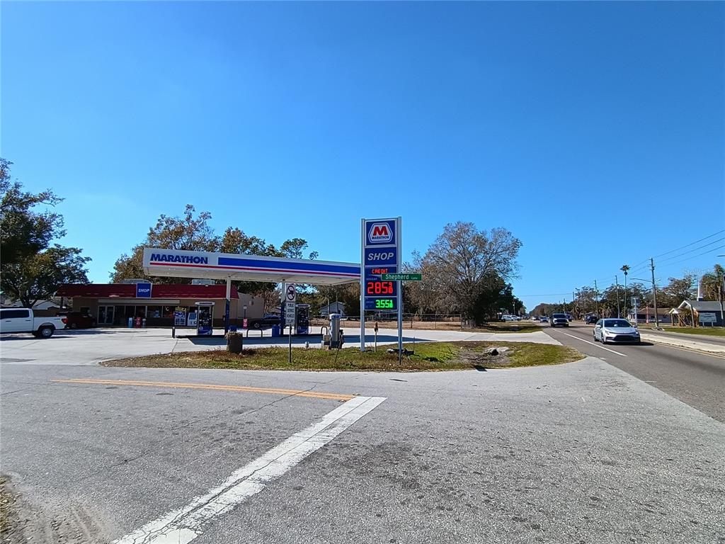 A Marathon gas station with a convenience store and fuel pumps sits on a corner lot — 1608 SHEPHERD LANE, INTERCESSION CITY, FL