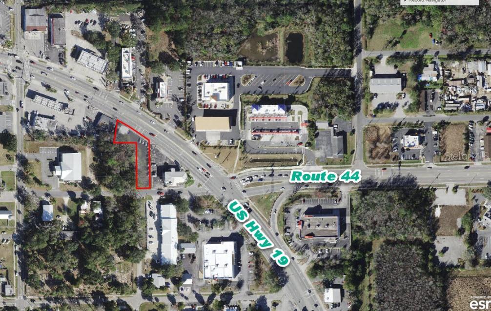 This aerial map shows a commercial property outlined in red near a major road intersection — 602 NE US HIGHWAY 19, CRYSTAL RIVER, FL