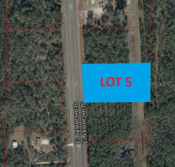 An aerial map shows a rectangular plot of land labeled Lot 5 along a highway — TBD US 19, INGLIS, FL