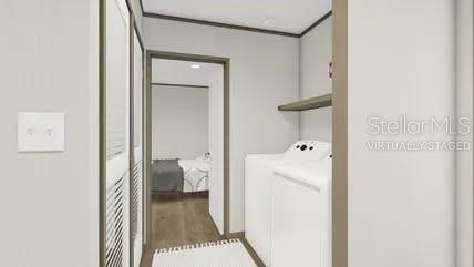 This is a rendering of a laundry room with white appliances and a doorway leading to a bedroom — 0 HARLEM AVENUE, EUSTIS, FL
