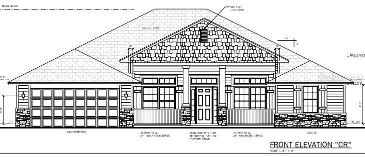 A kitchen features white cabinets, stainless steel appliances, granite countertops, and a center island — 247 SW BELLFLOWER DRIVE, LAKE CITY, FL