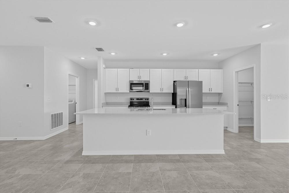 This is a floor plan for a single-story house with four bedrooms and a two-car garage — 6754 EQUINOX LANE, NORTH FORT MYERS, FL