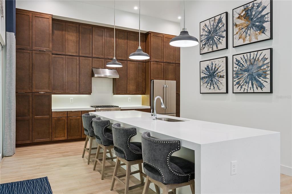 A modern townhouse exterior features white stucco walls, wood-look siding, and a black-framed front door — 512 W SWOOPE AVENUE, WINTER PARK, FL