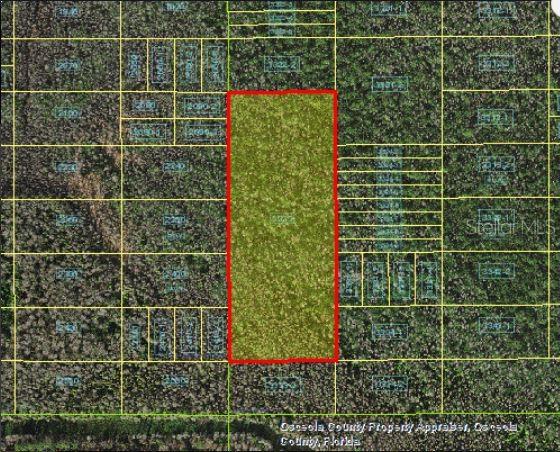 This is a map showing a rectangular parcel of land highlighted in red — HOLOPAW GROVES ROAD, ST CLOUD, FL