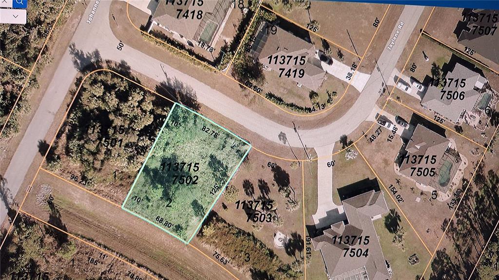 This is an aerial map showing a vacant residential lot highlighted in light blue — JAYLENE ROAD, NORTH PORT, FL