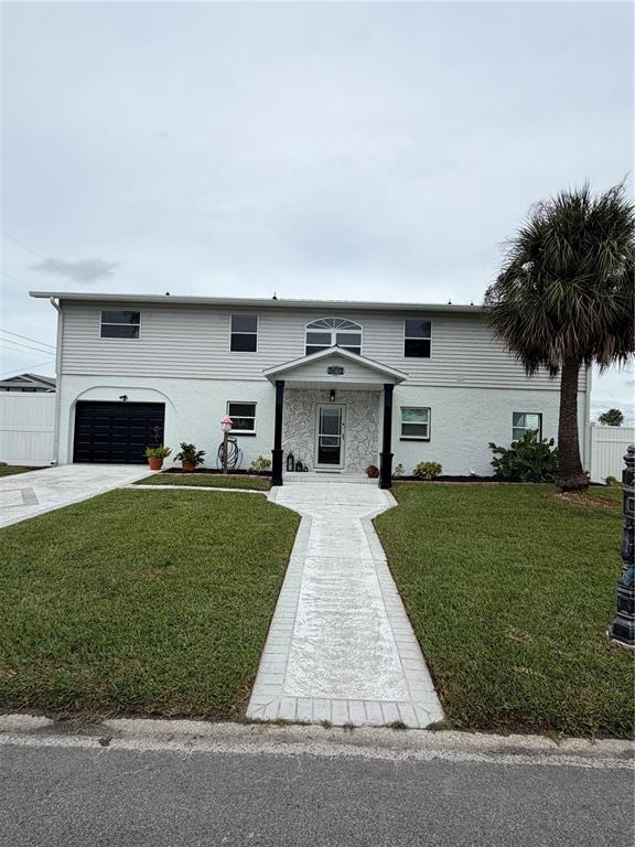 An aerial view shows a waterfront house with a pool and boat dock on a canal — 3173 GULFVIEW DRIVE, HERNANDO BEACH, FL