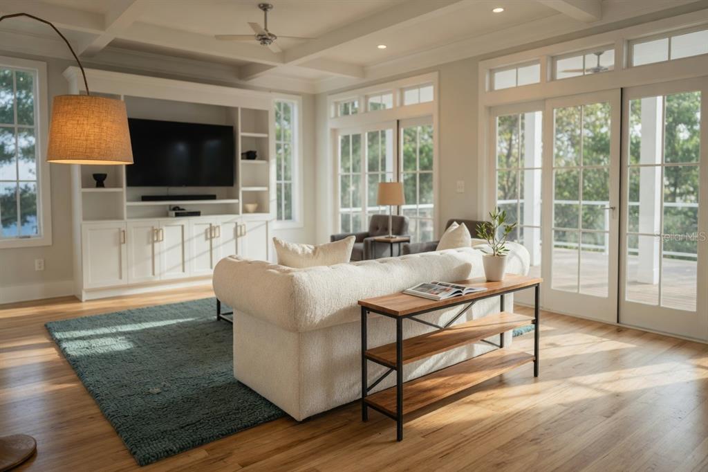 A living room features a white sofa, a wooden console table, and built-in shelving — 0000 SE 4TH AVENUE, CRYSTAL RIVER, FL