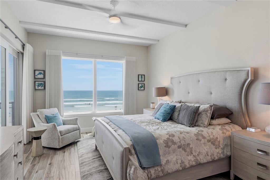 A view through a doorway shows a bedroom and an adjacent bathroom with a shower — 807 S ATLANTIC AVENUE UNIT 303, NEW SMYRNA BEACH, FL