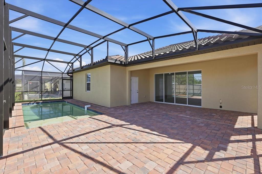 An aerial view shows three suburban houses with screened-in pools and tile roofs — 367 VILLA SORRENTO CIRCLE, HAINES CITY, FL