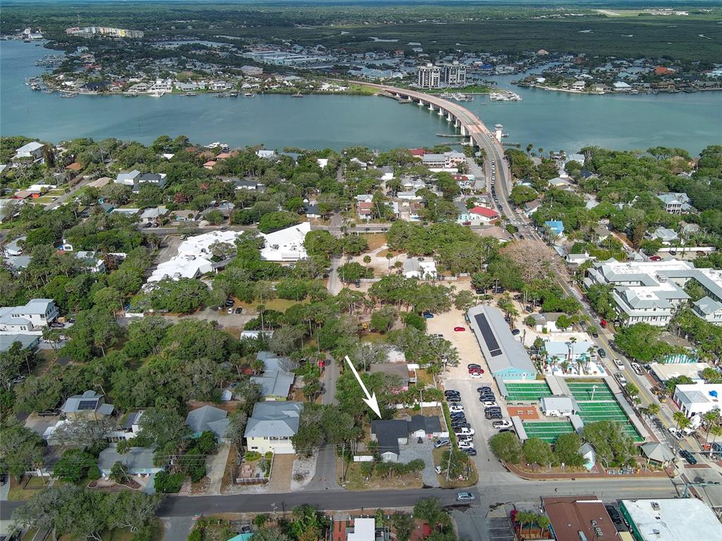 An aerial view of a coastal town with a highlighted property near the beach — 200 S PINE STREET, NEW SMYRNA BEACH, FL