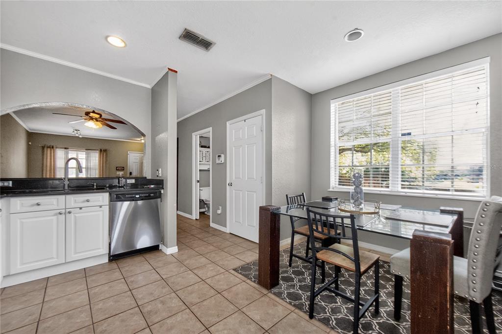 A small room with light green walls, a window, and tan tile flooring — 4204 PLANTATION COVE DRIVE, ORLANDO, FL