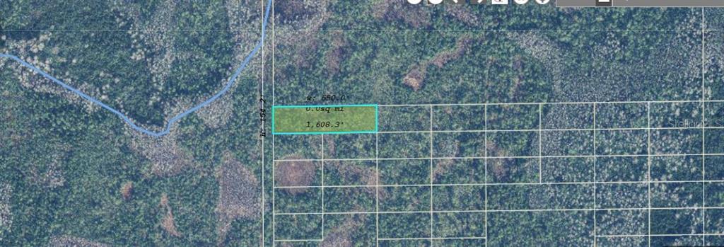This is an aerial map showing a rectangular parcel of land highlighted in blue — 2473 DILL ROAD, ORLANDO, FL
