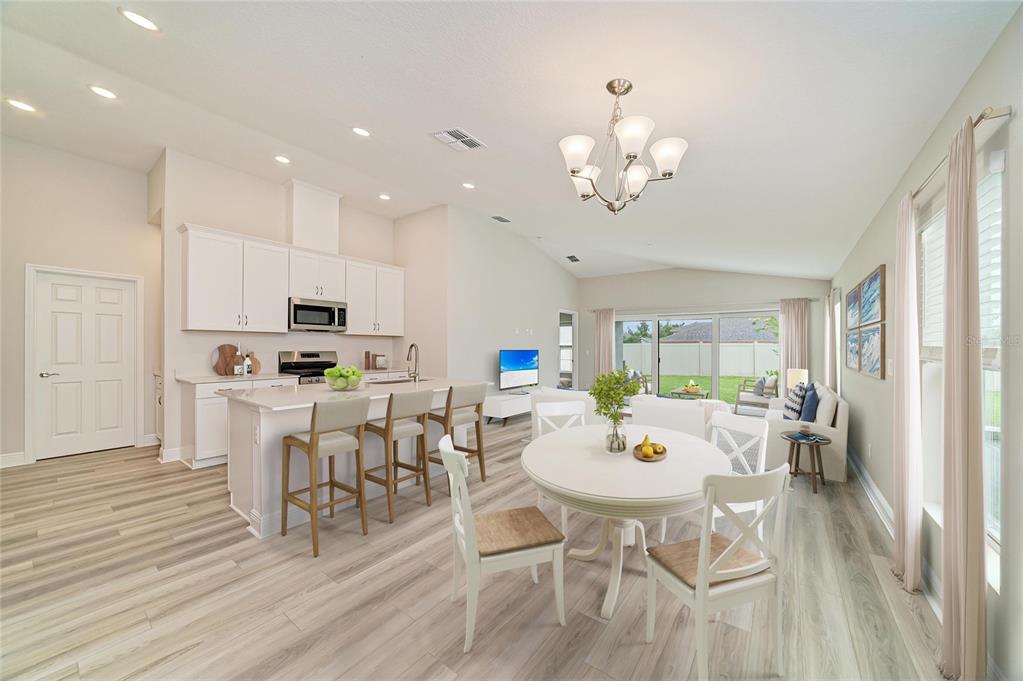 An interior view of a house under construction with exposed wooden framing and insulation — 12361 OAK  HILL WAY, PARRISH, FL