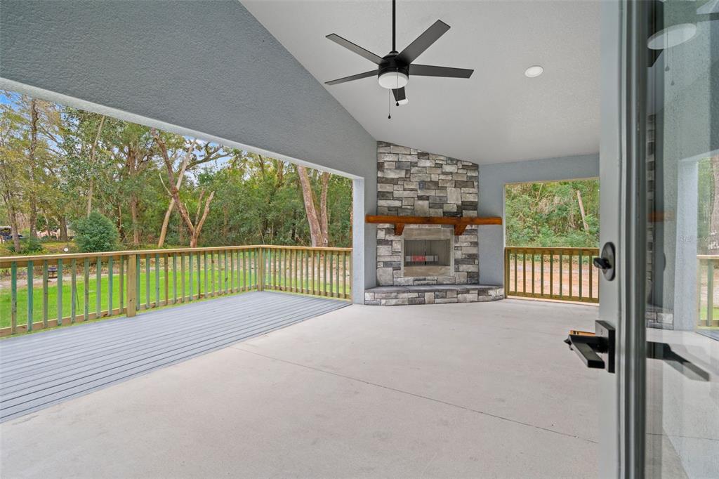 A kitchen features blue cabinets, white countertops, stainless steel appliances, and a blue-patterned floor — 478 LINCOLN AVENUE, BROOKSVILLE, FL