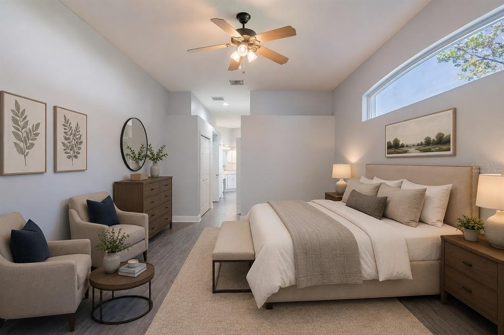 A bedroom with a king bed, two armchairs, a dresser, and a ceiling fan — 4810 WATER LARK WAY, VALRICO, FL