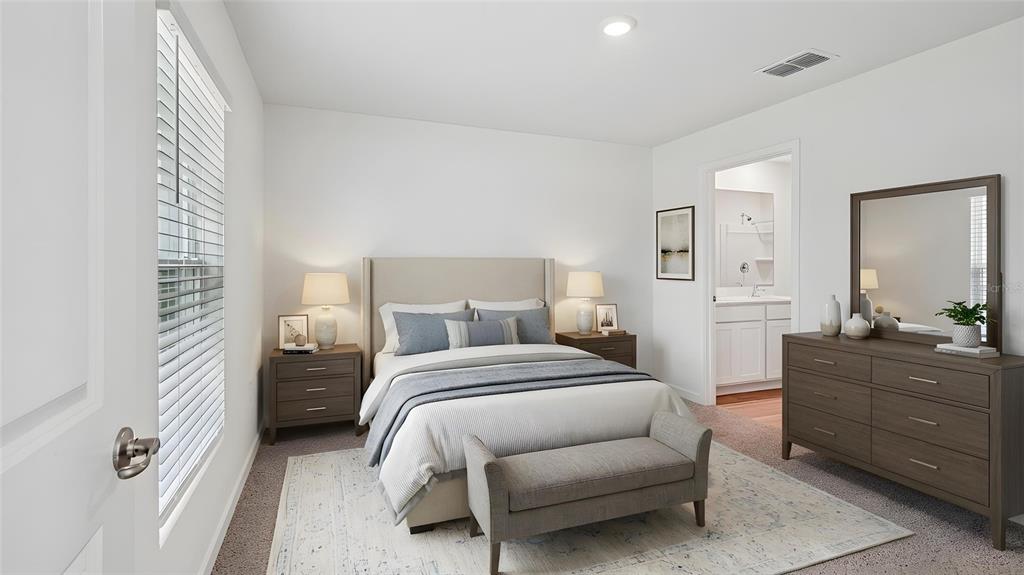 A bedroom features a bed with a beige headboard, two nightstands, and a wooden dresser — 4129 KONA CIRCLE, SPRING HILL, FL