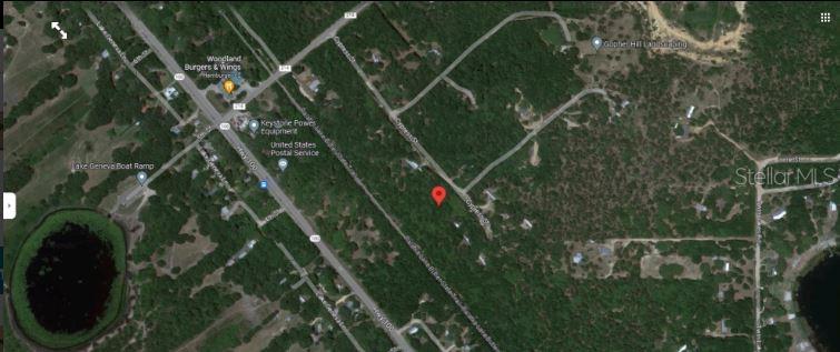 This is a satellite map view showing a red pin marking a wooded land parcel — 3RD STREET, KEYSTONE HEIGHTS, FL