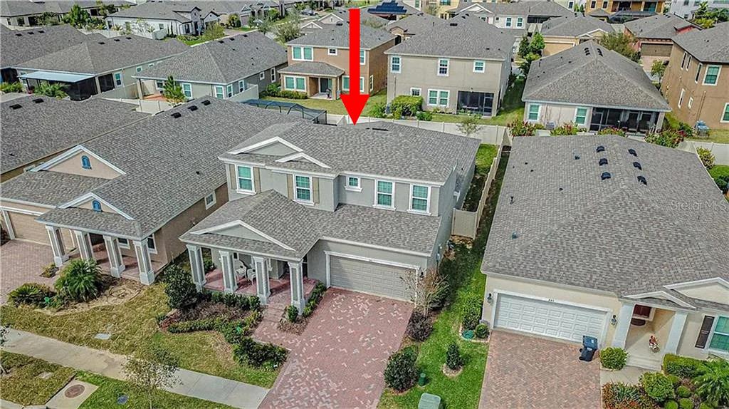 An aerial view shows a two-story suburban house with a gray roof and driveway — 843 VISCOUNT STREET, BRANDON, FL
