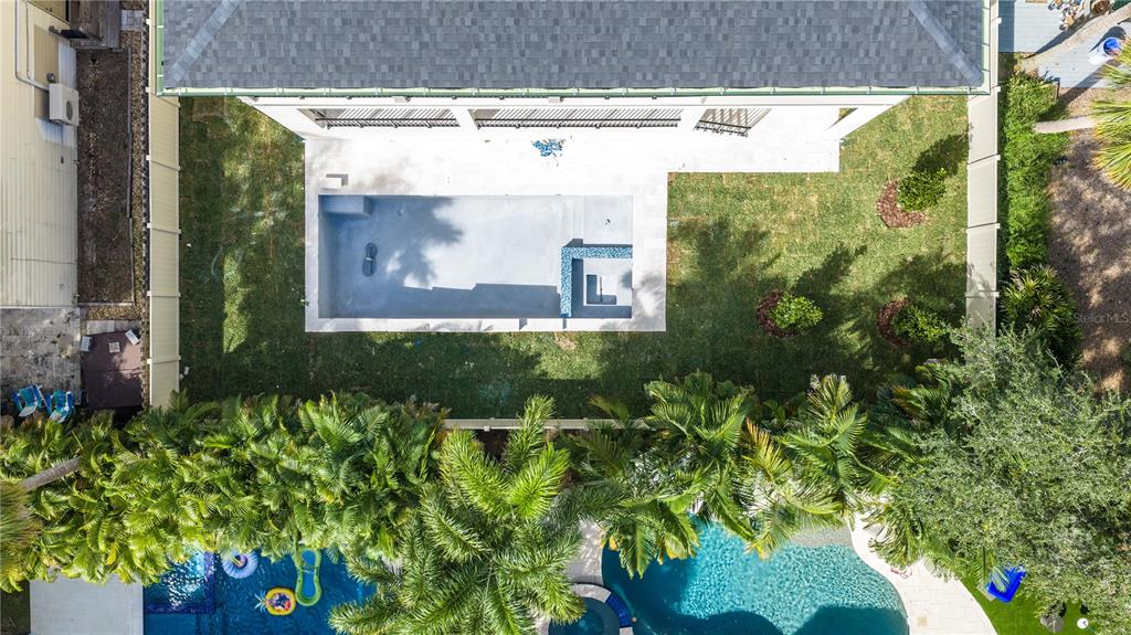 A two-story house under construction features concrete block walls, green sheathing, and a front porch — 4316 W CORONA STREET, TAMPA, FL