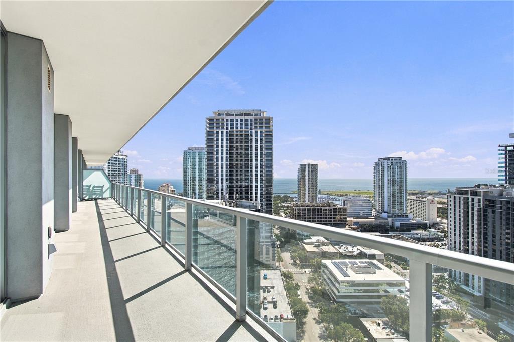 An elevated view of a city skyline featuring high-rise buildings, a marina, and the ocean — 400 CENTRAL AVENUE UNIT 2505, ST PETERSBURG, FL